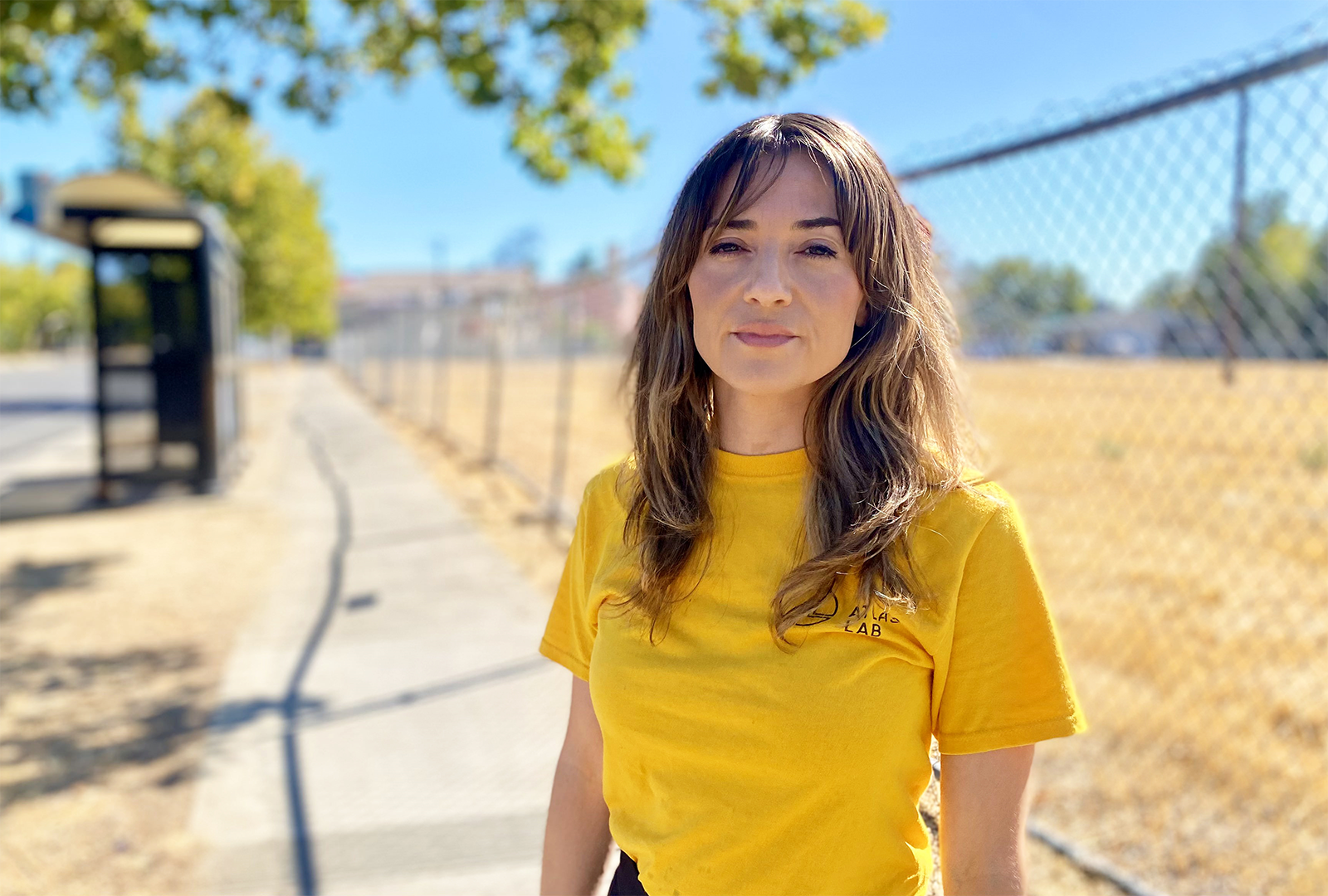 Kimberly Garza stands on a sidewalk in Sacramento.