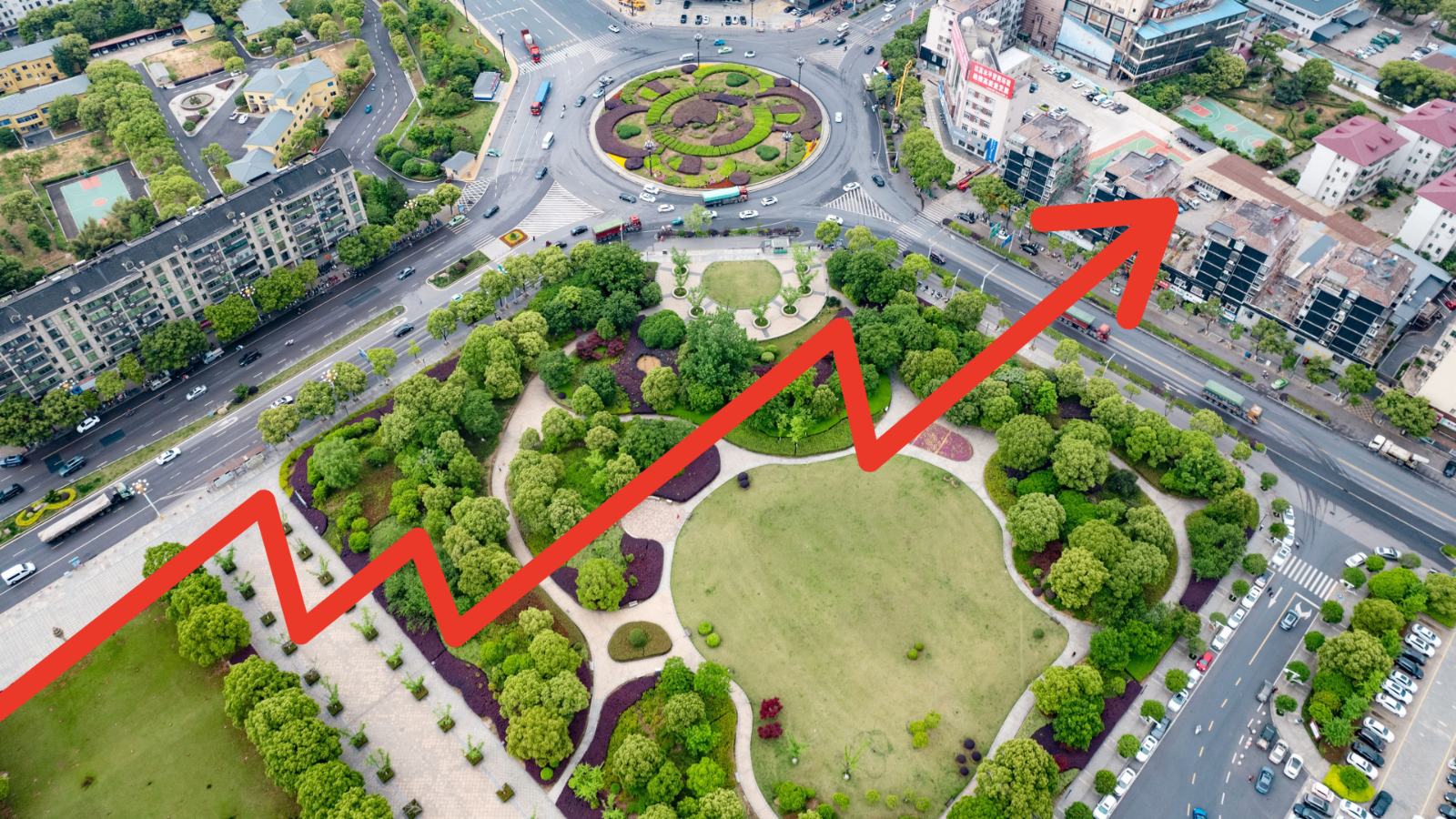 image of a landscaped intersection with a red data line graphic in the foreground