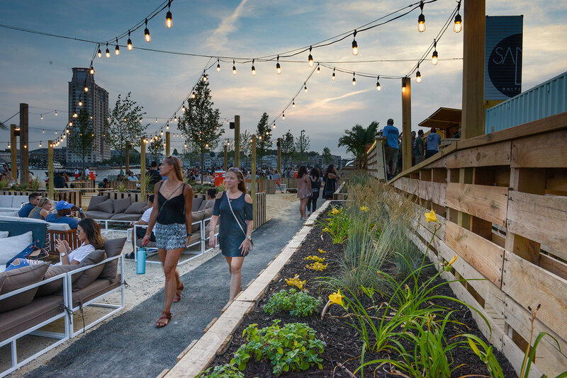 Visitors walk through Mahan Rykiel Associates' The Sand Lot in Baltimore, Maryland