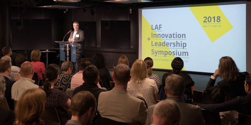 Speaker and audience at the sold-out 2018 symposium