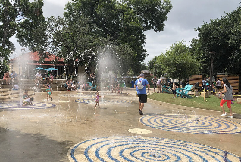 Visitors enjoy the Waterworks Area of Yanaguana Garden