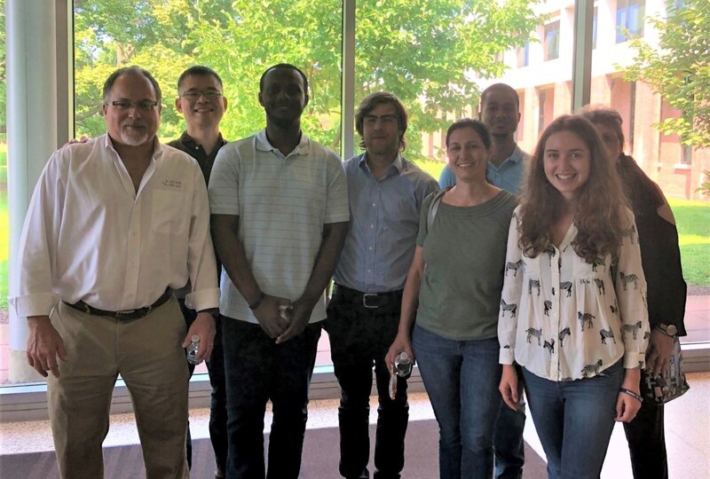 Anchor QEA staff members pose for a photo by the window.