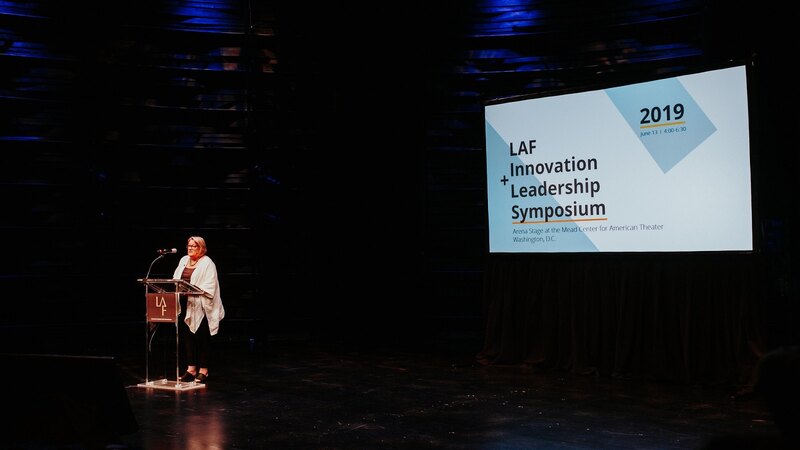 LAF Board Member Stepahnie Rolley delivering opening remarks at the 2019 symposium