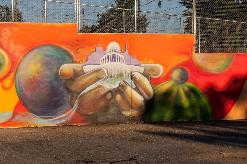 Mural in farmer's market area by Ward 7 artist Jay Coleman, planned and painted with teen volunteers.