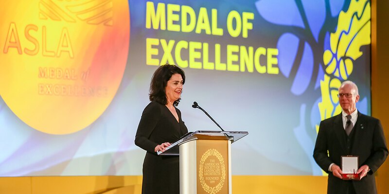 LAF CEO Barbara Deutsch at a podium receiving the ASLA Medal of Excellence