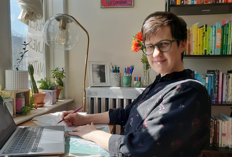 Andrea Johsnon sitting at her home work area