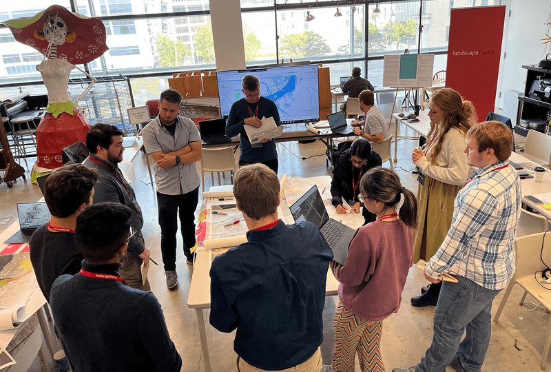 A team gathers to design the river crossing. 