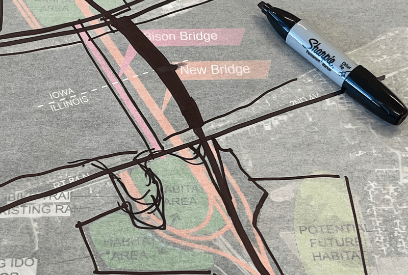 A marker lays on top of a design.