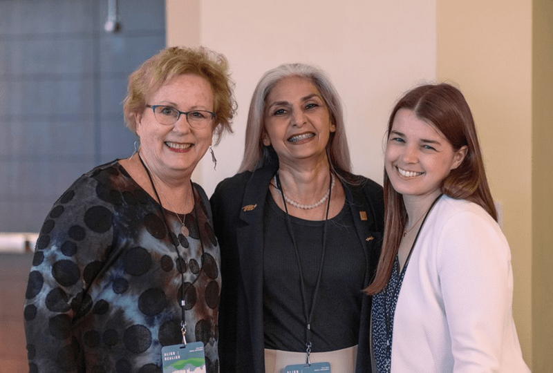 Emily O'Mahoney, Ebru Ozer and Megan Barnes smile together.