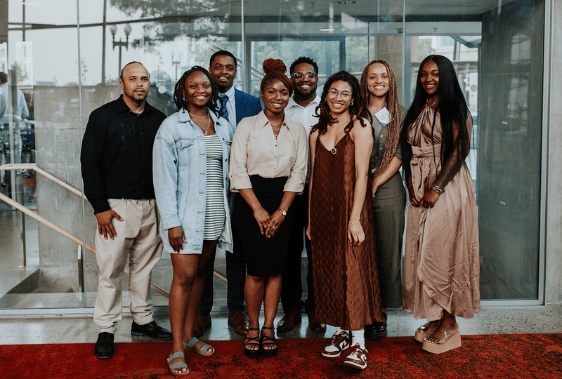 The inaugural cohort of LAF Ignite participants gathers and smiles.