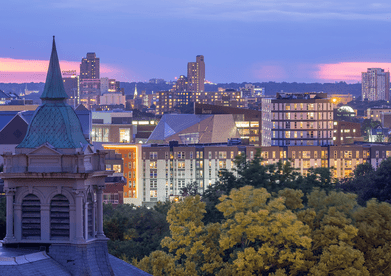 The Minneapolis skyline is shown at dusk.