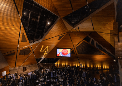 Looking down on the sizable crowd below the angular, wood-paneled walls of the venue