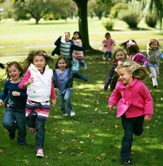 Kids running in a park