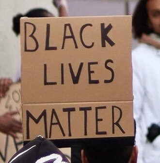 Black Lives Matter protest sign in crowd