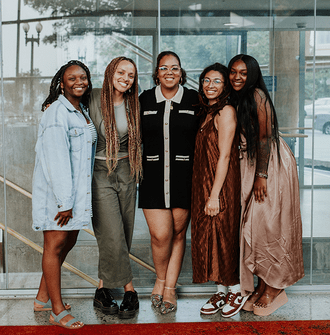 The 2023 LAF Ignite winners stand and smile with Kendra Hyson.