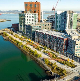 Image of the Mission Creek linear park from above, showing the walkways and rain gardens