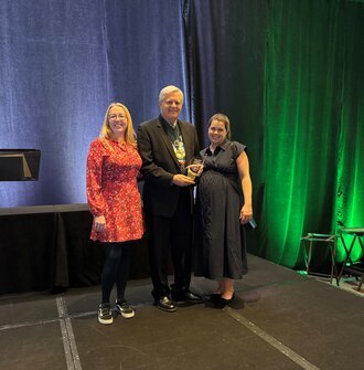 LAF staff present award to Ken Brooks