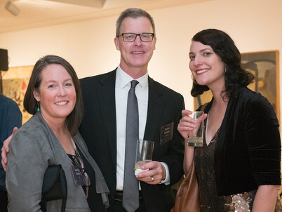 Jennifer Guthrie, Duane Krueger, and Lisa Switkin pose together at the 2018 LAF Annual Benefit