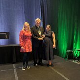 LAF staff present award to Ken Brooks