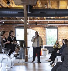 A presenter speak at an event on equity and inclusion co-hosted by LAF and Sasaki