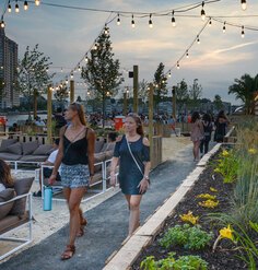 Visitors walk through Mahan Rykiel Associates' The Sand Lot in Baltimore, Maryland