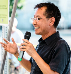 Jeff Hou speaking into a microphone