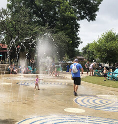 Visitors enjoy the Waterworks Area of Yanaguana Garden