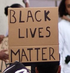 Black Lives Matter protest sign in crowd