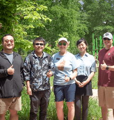 The Texas A&M team gives a thumbs-up at the Houston Arboretum and Nature Center.
