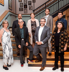 The 2022-23 cohort of LAF Fellows gathers on a staircase.