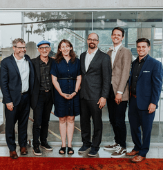 The 2022-23 LAF Fellows stand beside each other and smile. 