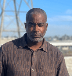 Anton Smith stands on a bridge in Los Angeles.