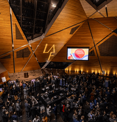 Looking down on the sizable crowd below the angular, wood-paneled walls of the venue